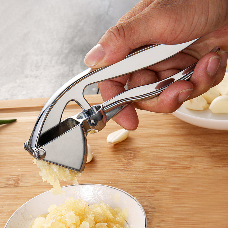 ORANGLES Stainless Steel Manual Garlic Press Masher - detailed closeup view - illustrating benefits - Image 3 of 4 | created for all | Shop Stainless Steel Manual Garlic Press Masher North Carolina | Free Shipping ORANGLES